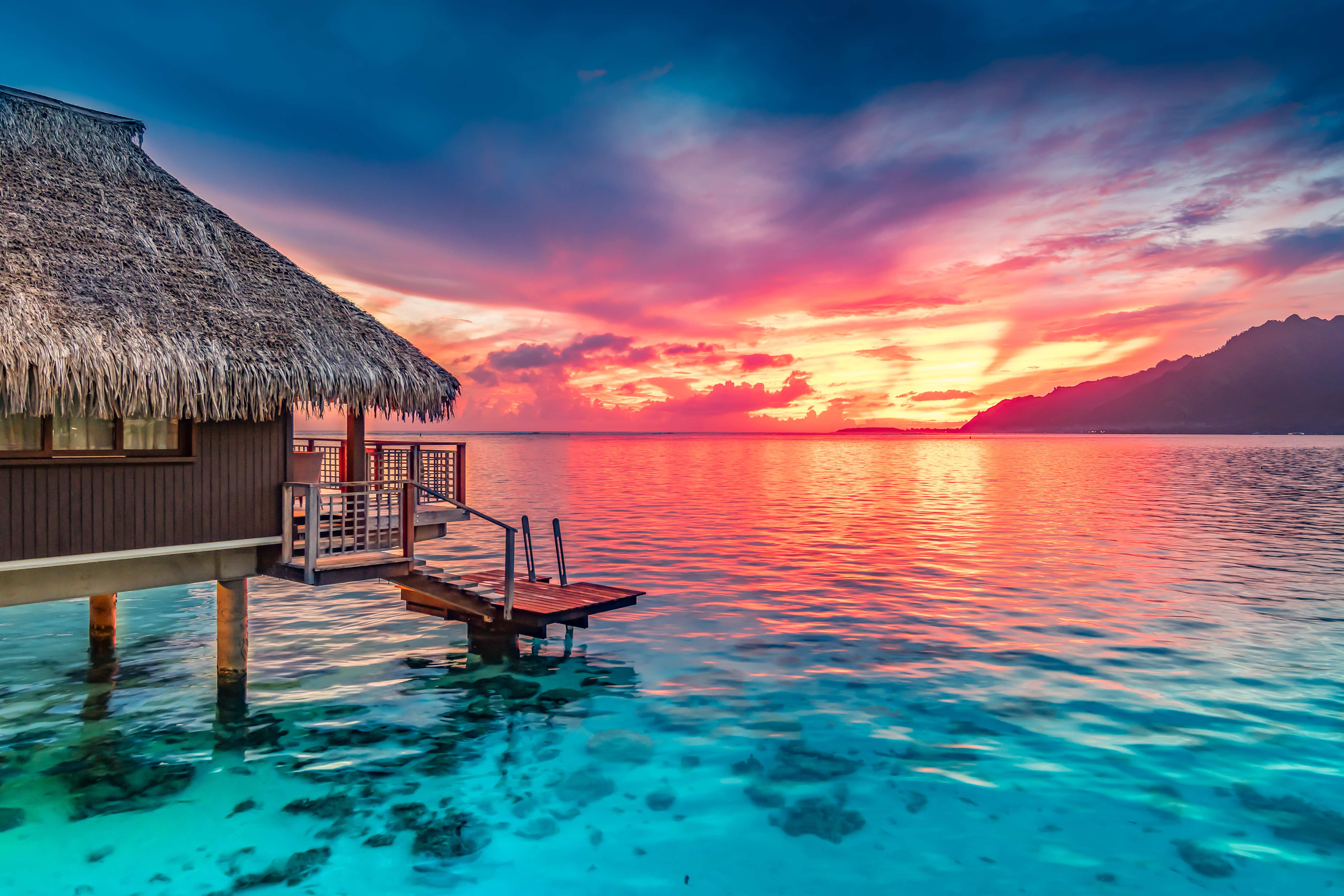 Maldives overwater bungalows at sunset