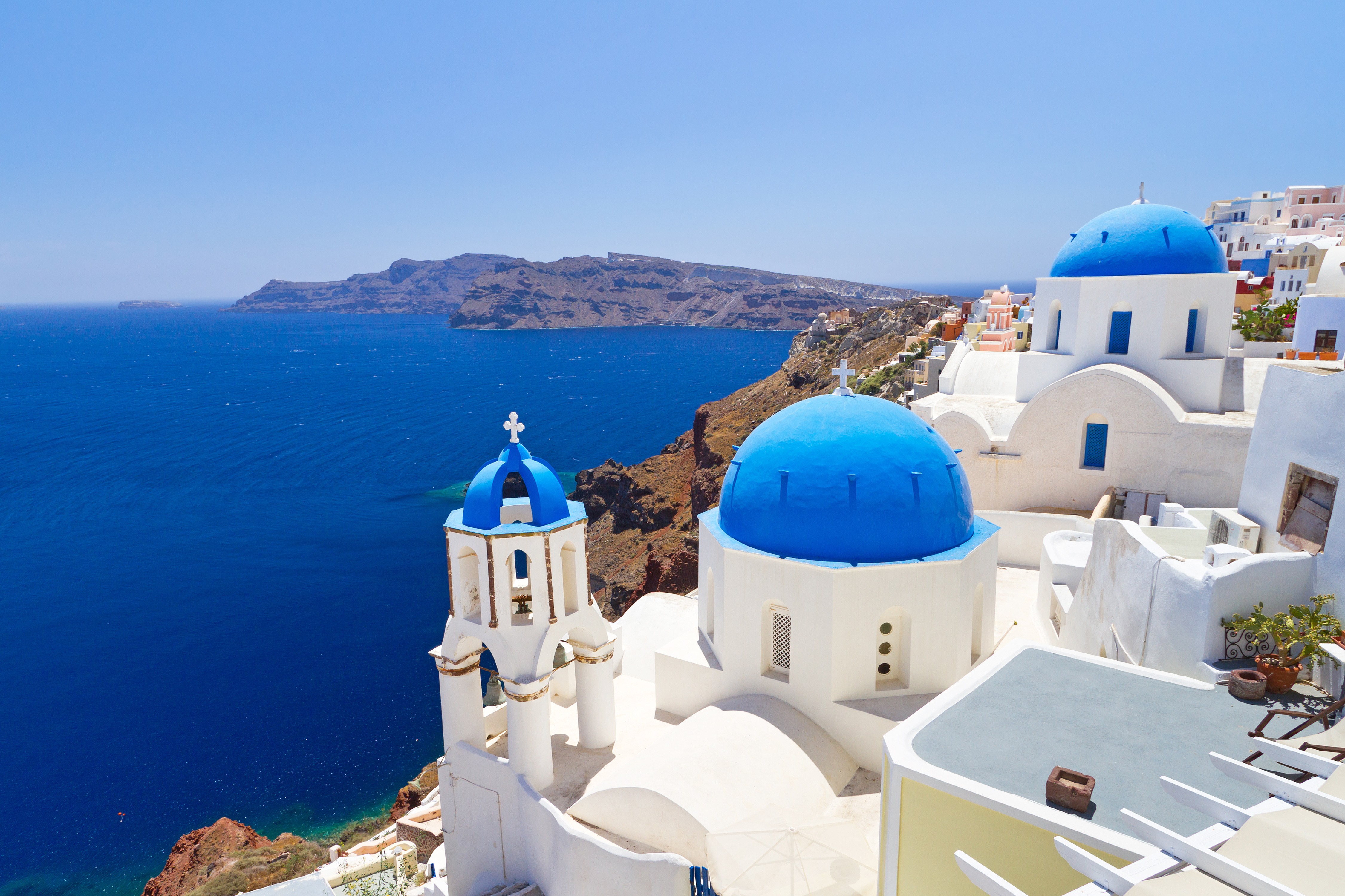 Santorini whitewashed buildings with blue domes